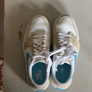 Nike Kids' White and Tan Sneakers with Blue Accents